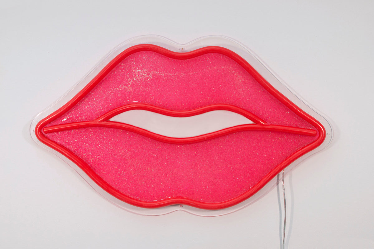 Red lips neon sign on the wall